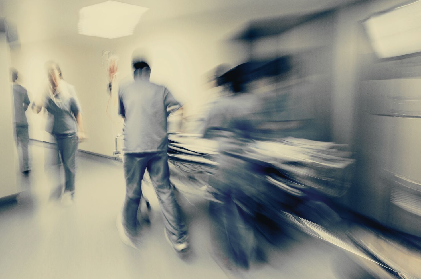 Emergency Room Doctors Rush Patient Down Hallway Emergency Room Doctors Rush Patient Down Hallway