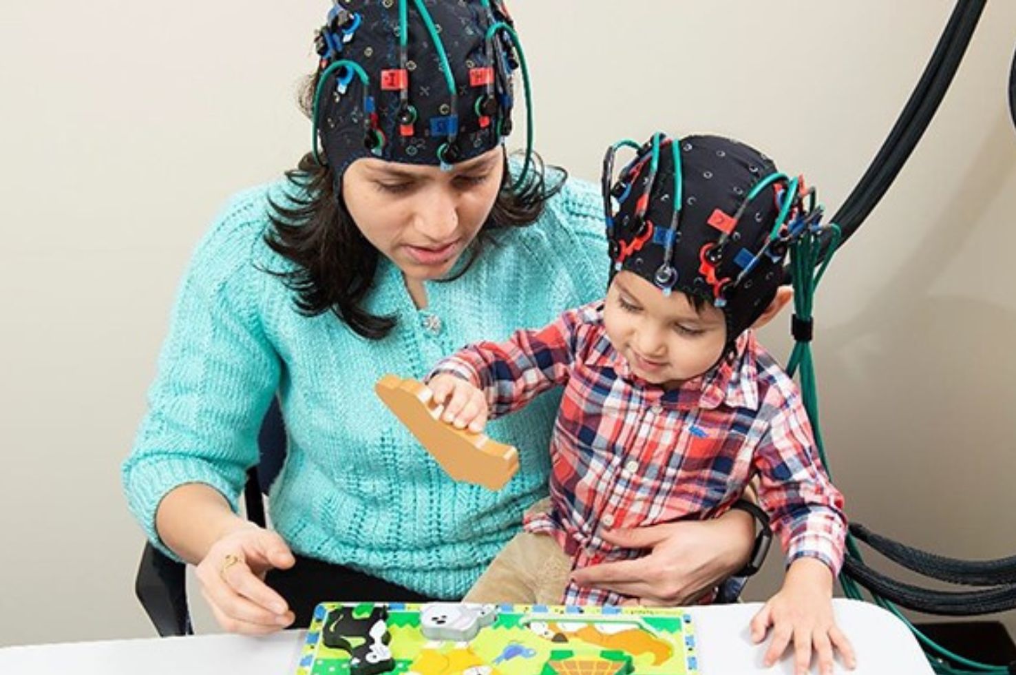 Researcher and Child with Headsets On