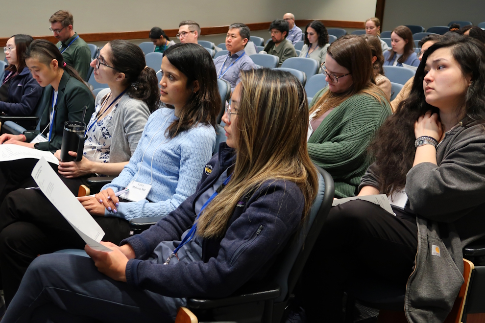 Attendees of the Clinician Educator Showcase seated in the auditorium